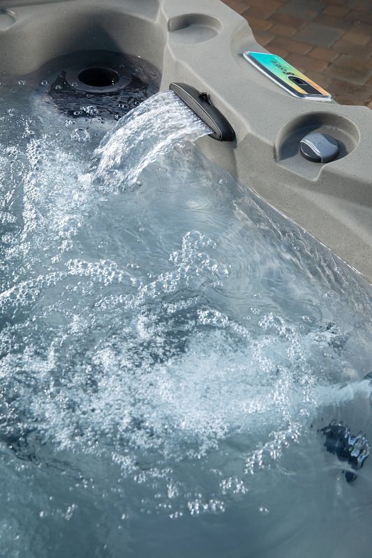 Jet waterfall flowing into Fantasy Spas hot tub